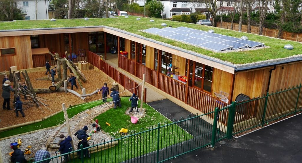 Modular timber frame eco nursery with seedum roof and solar panels by TGEscapes with cedar cladding