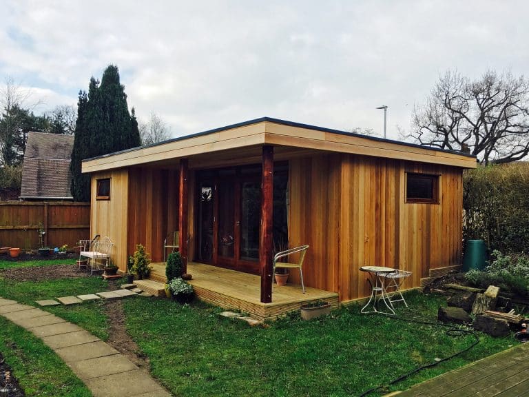 Dawson timber frame Garden Annexe by TGEscapes with cedar cladding and decking area