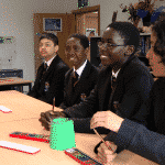 Inspired students in their Classroom Block for 600 students at Woolwich Polytechnic Secondary School by TGEscapes with cedar cladding