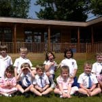 new school intake sitting outside their eco-classroom