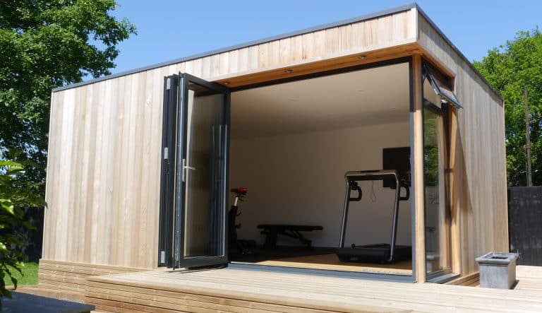 Modular Timber Frame Garden Gym with corner window and cedar cladding