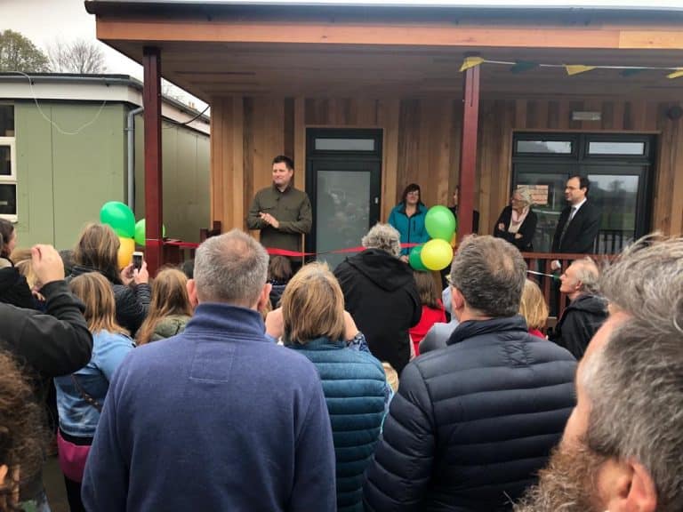 George Clarke cuts the ribbon for eco-classroom at North Nibley