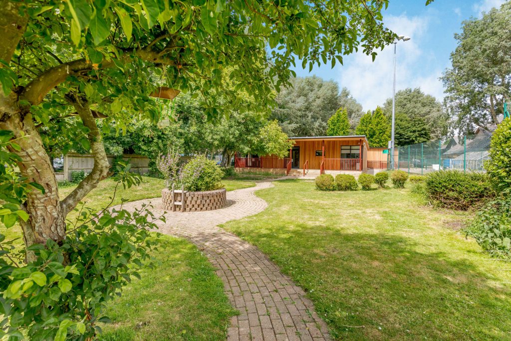 Modular timber frame building in a biodiverse setting