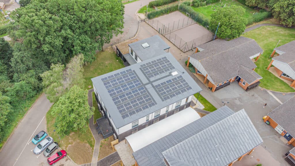 exterior aerial photo of solar panels on a building roof